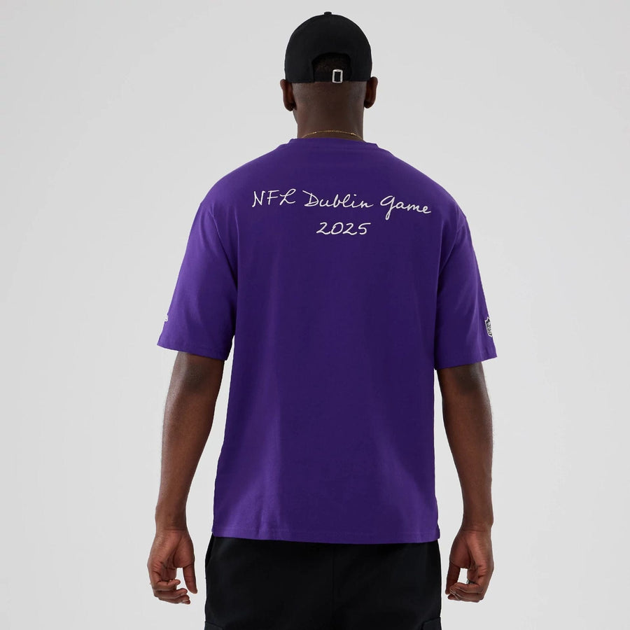 The Male model is wearing Minnesota Vikings NFL International Series Games 2025 Purple Premium T-Shirt  2