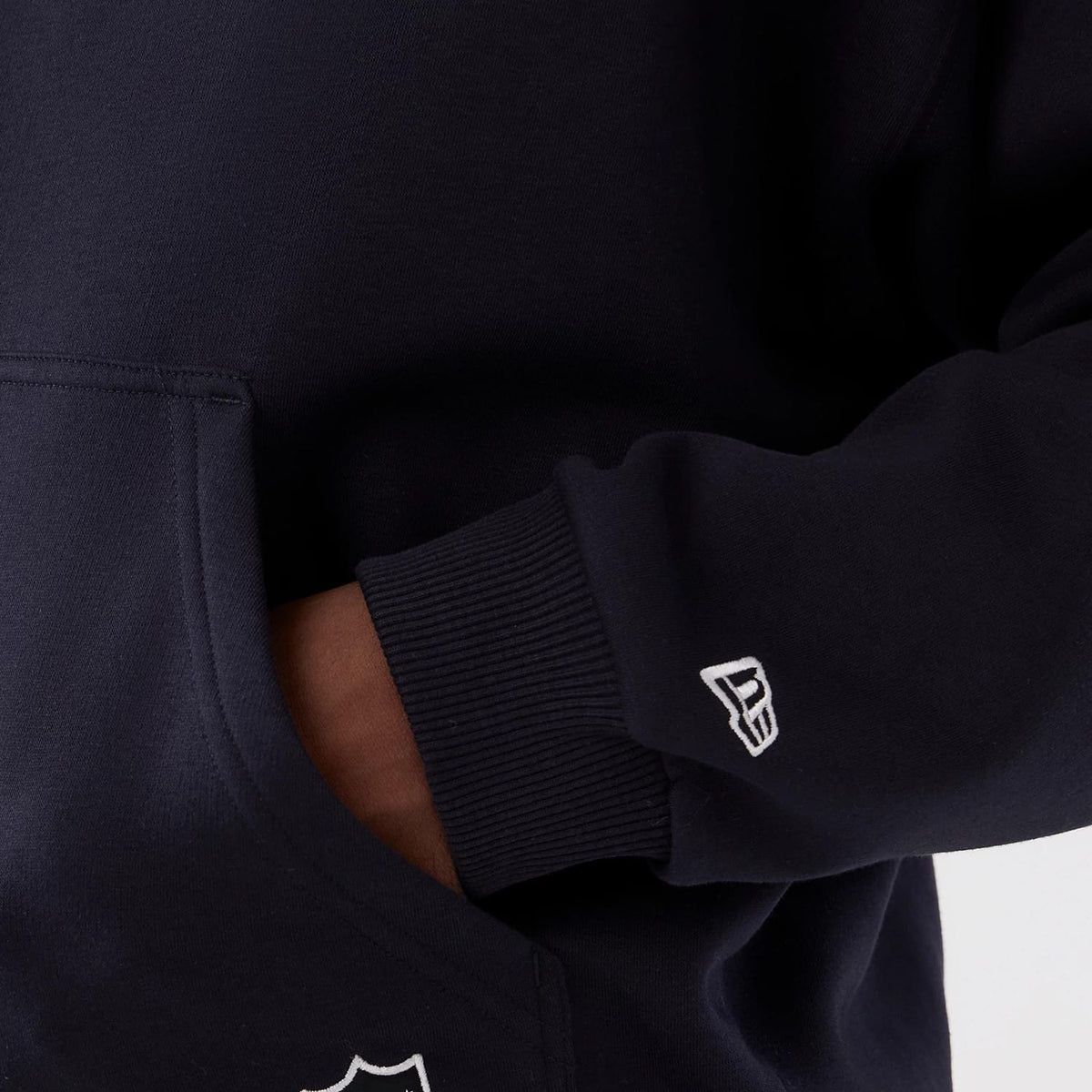 The Male model is wearing Denver Broncos NFL International Series Games 2025 Navy Premium Pullover Hoodie 6