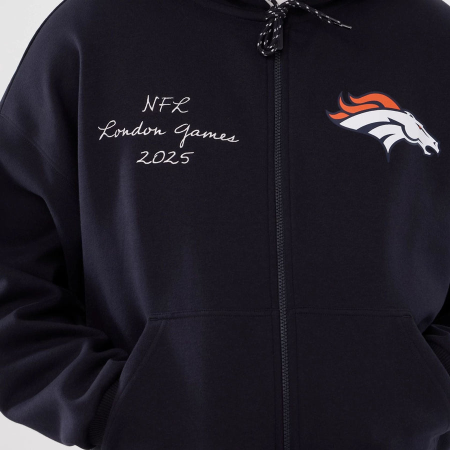 The Male model is wearing Denver Broncos NFL International Series Games 2025 Navy Premium Pullover Hoodie  3