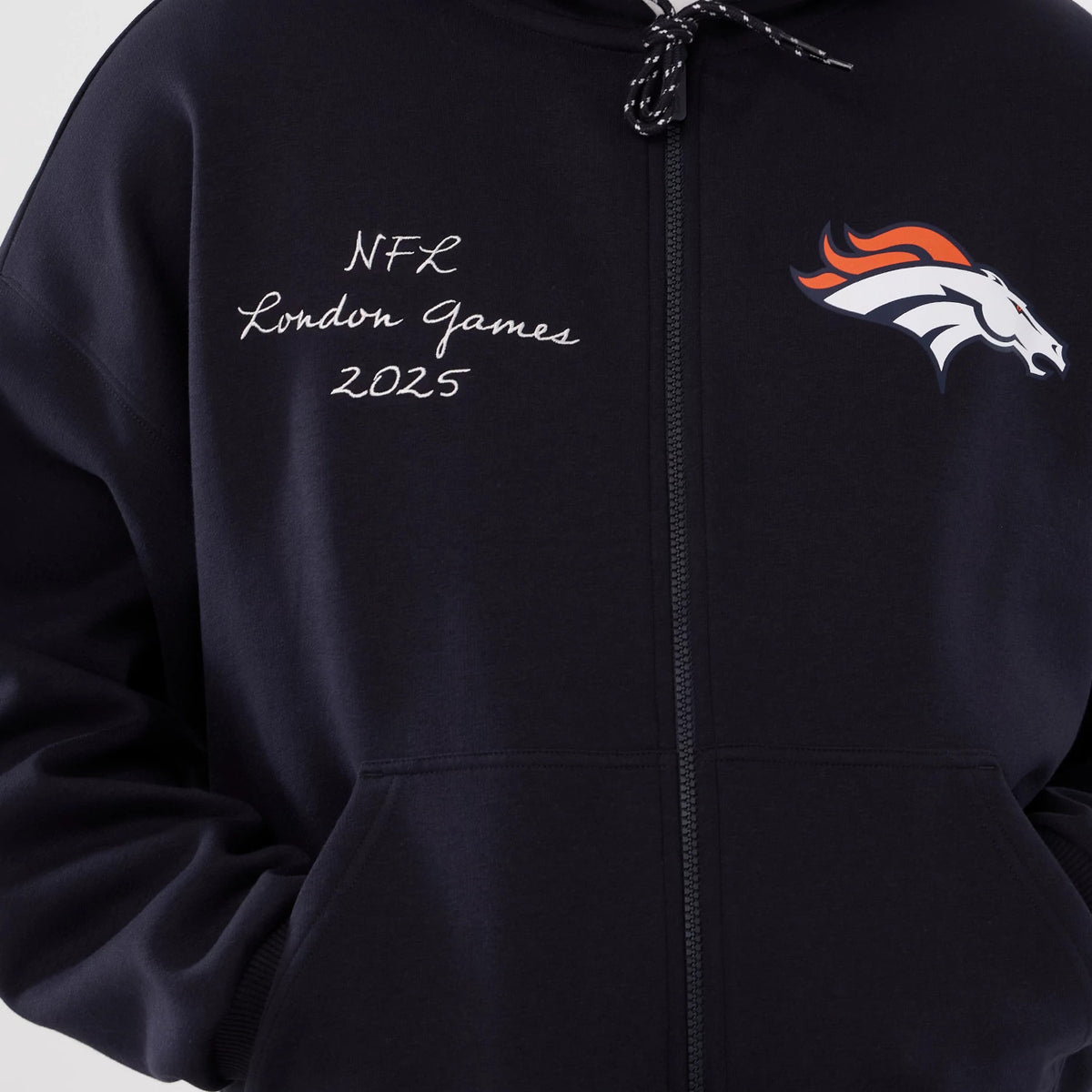New Era Denver Broncos NFL International Series Games 2025 Navy Premium Pullover Hoodie, front view showing the embroidered NFL London Games 2025 text on the left side and the Denver Broncos logo on the right chest above the zip.