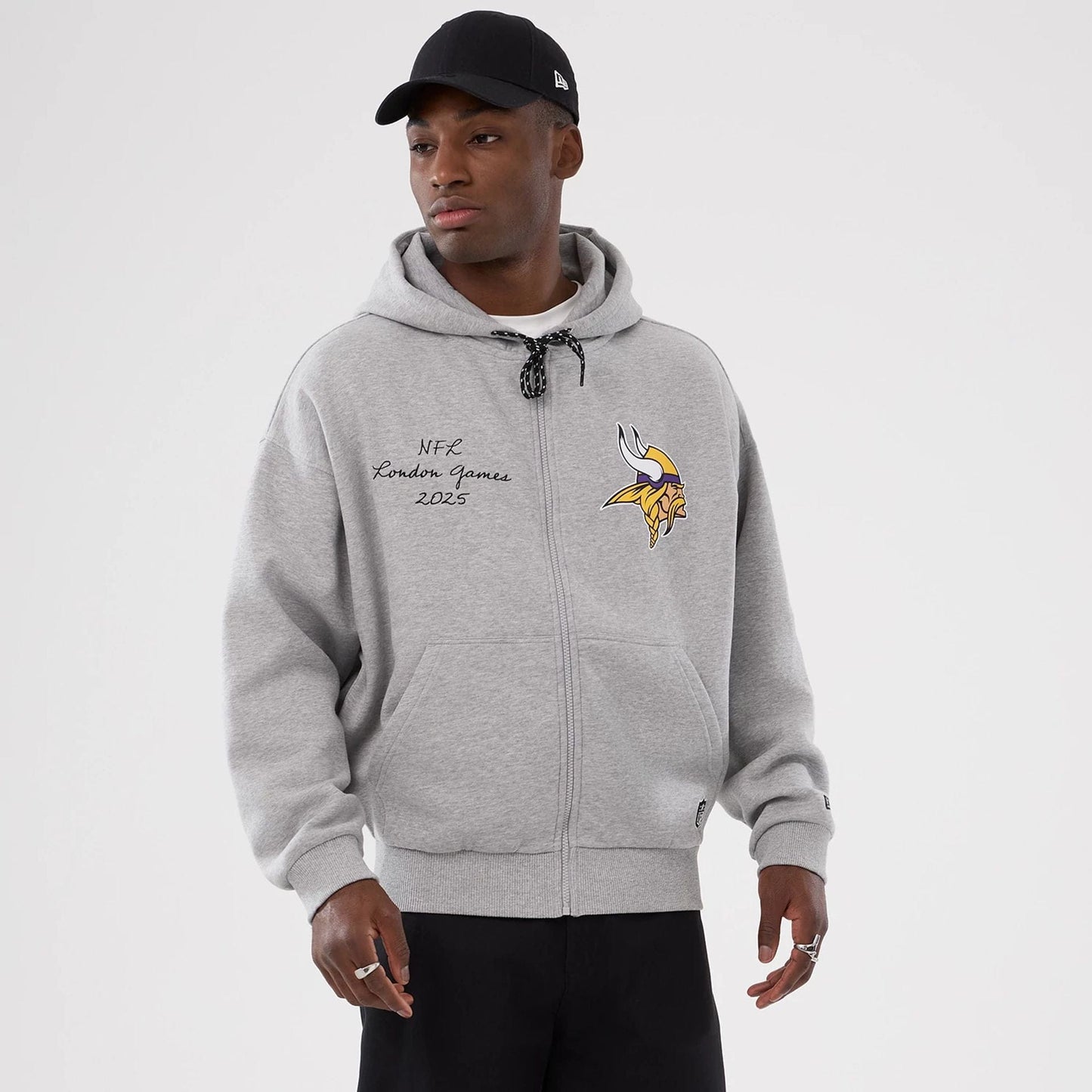 The Male model is wearing Minnesota Vikings NFL International Series Games 2025 Grey Premium Pullover Hoodie  1