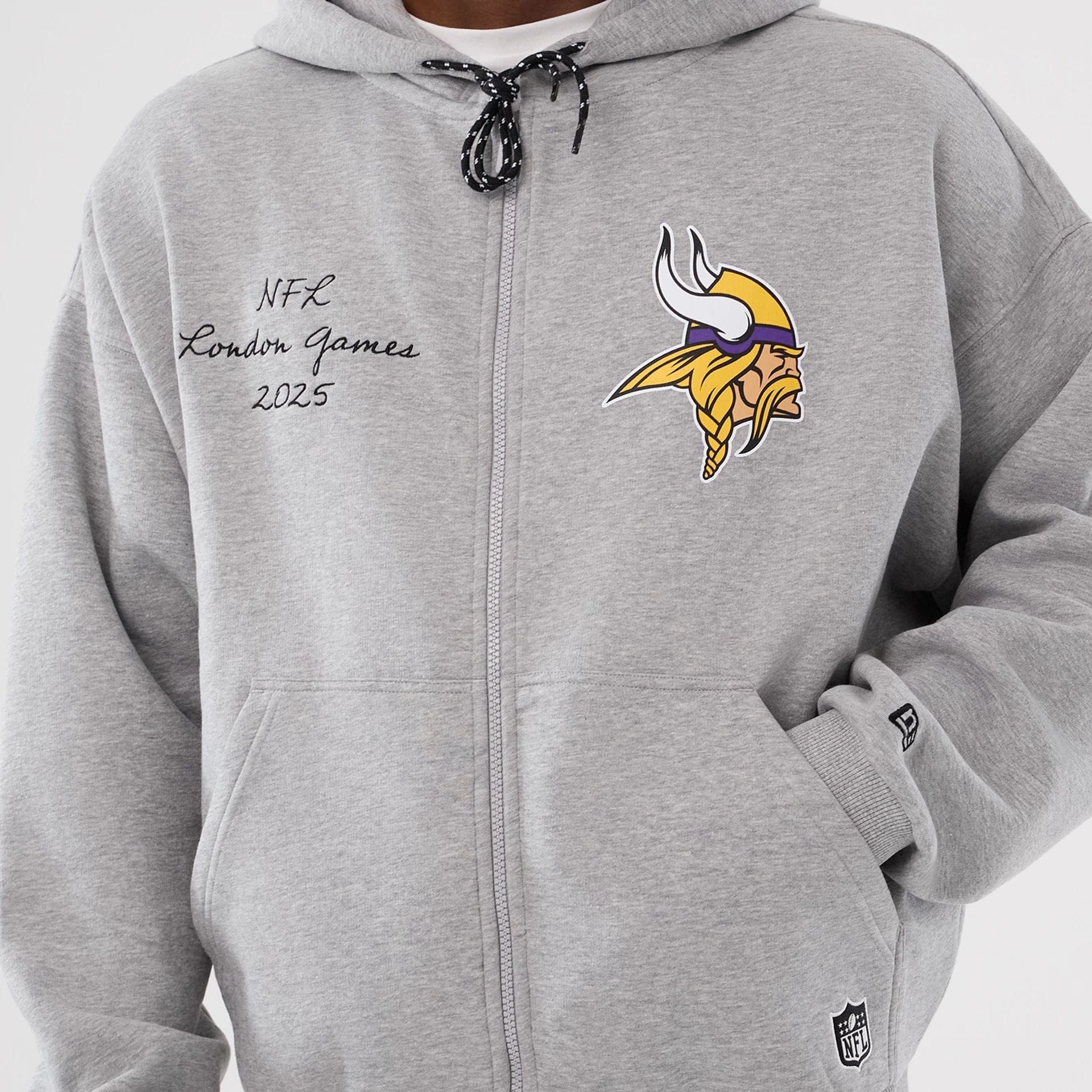 The Male model is wearing Minnesota Vikings NFL International Series Games 2025 Grey Premium Pullover Hoodie  3