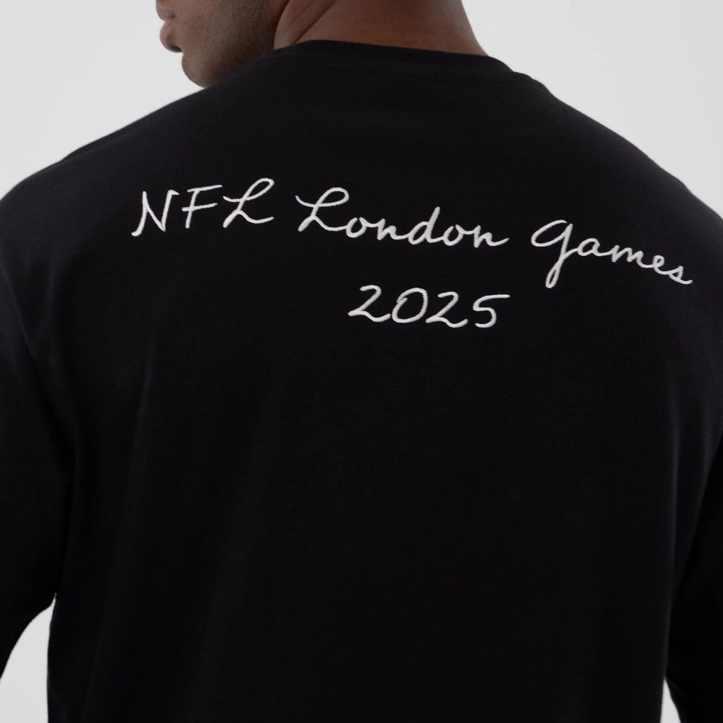 The Male model is wearing Minnesota Vikings NFL International Series Games 2025 Black Premium T-Shirt  5