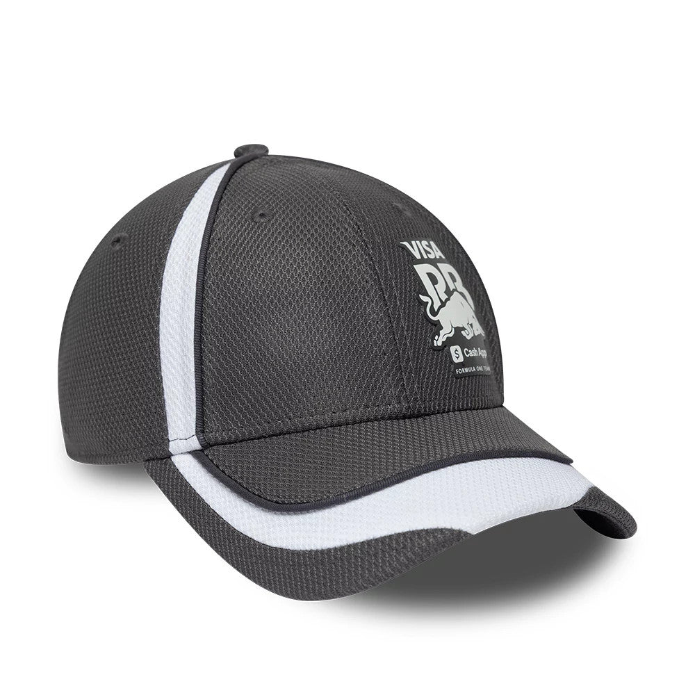 Visa Cash App Racing Bulls F1 Race Special Dark Grey New Era 9FORTY Adjustable Cap, three-quarter view showing raised white embroidered bull graphics on the structured dark grey crown, with a white-striped curved visor.