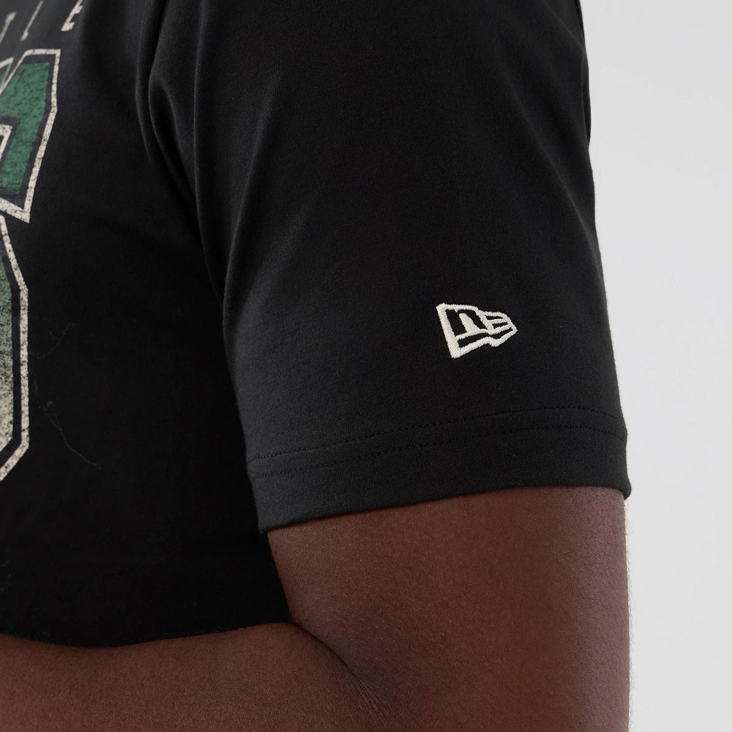 The model is wearing this NBA Hardwood Classic Seattle Supersonics T-Shirt in black. 4