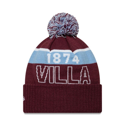 Pictured is this Aston Villa FC Bobble Knit Beanie hat in dark red. 2