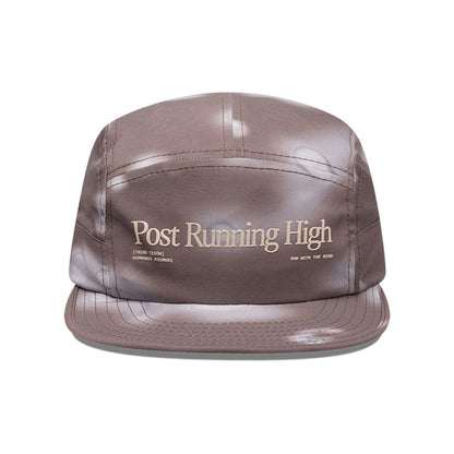 Pictured is this Hermanos Koumori x New Era Camper cap in dark brown. 2