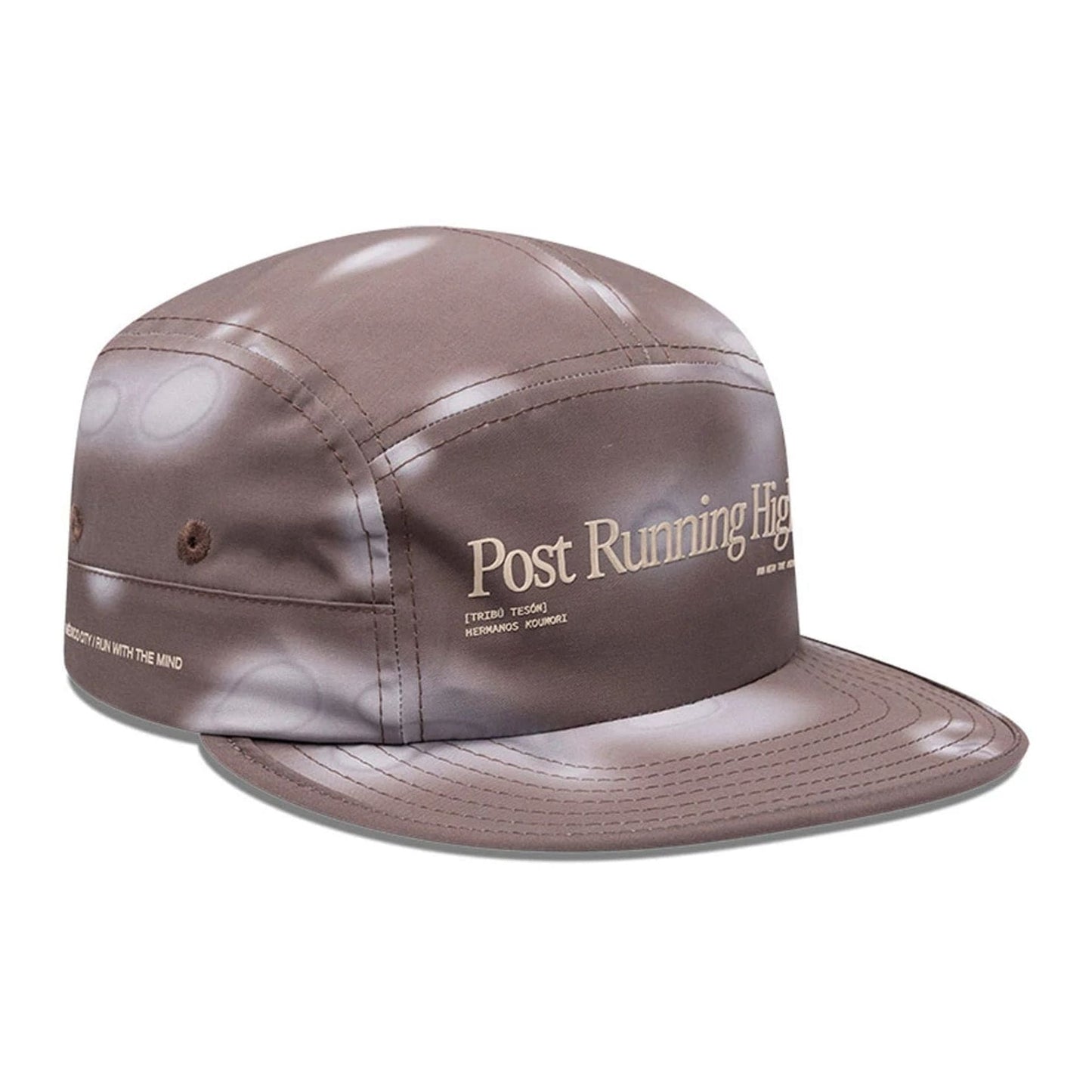 Pictured is this Hermanos Koumori x New Era Camper cap in dark brown. 3