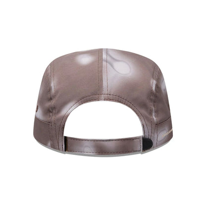Pictured is this Hermanos Koumori x New Era Camper cap in dark brown. 4