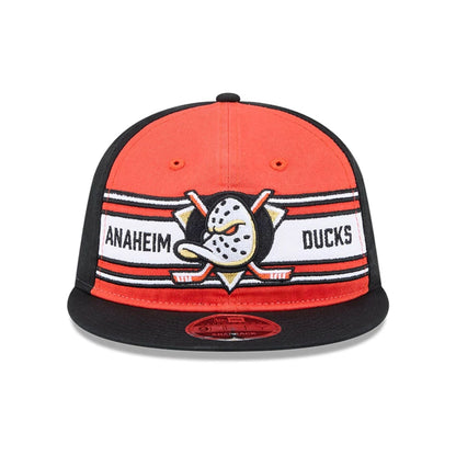Pictured is this NHL Team Stripes Anaheim Ducks Retro Crown 9FIFTY cap in orange. 2