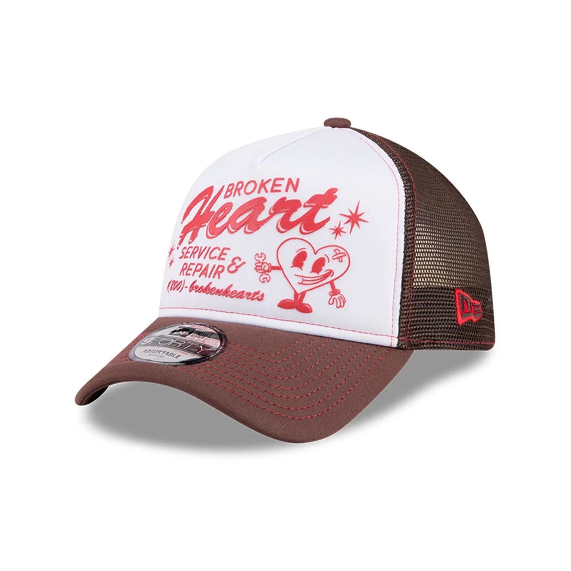 Pictured is this New Era Broken Heart Service & Repair 9FORTY A-Frame Trucker cap in white. 1