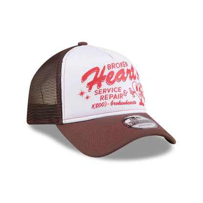 Pictured is this New Era Broken Heart Service & Repair 9FORTY A-Frame Trucker cap in white. 5