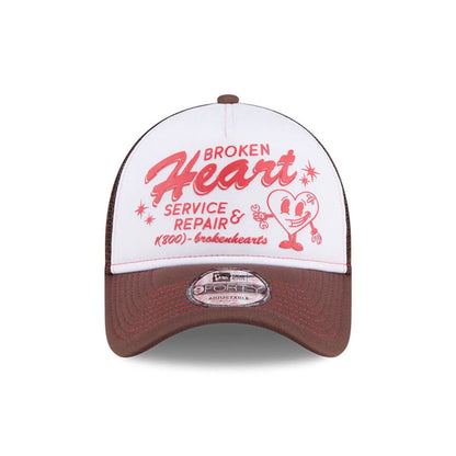 Pictured is this New Era Broken Heart Service & Repair 9FORTY A-Frame Trucker cap in white. 4