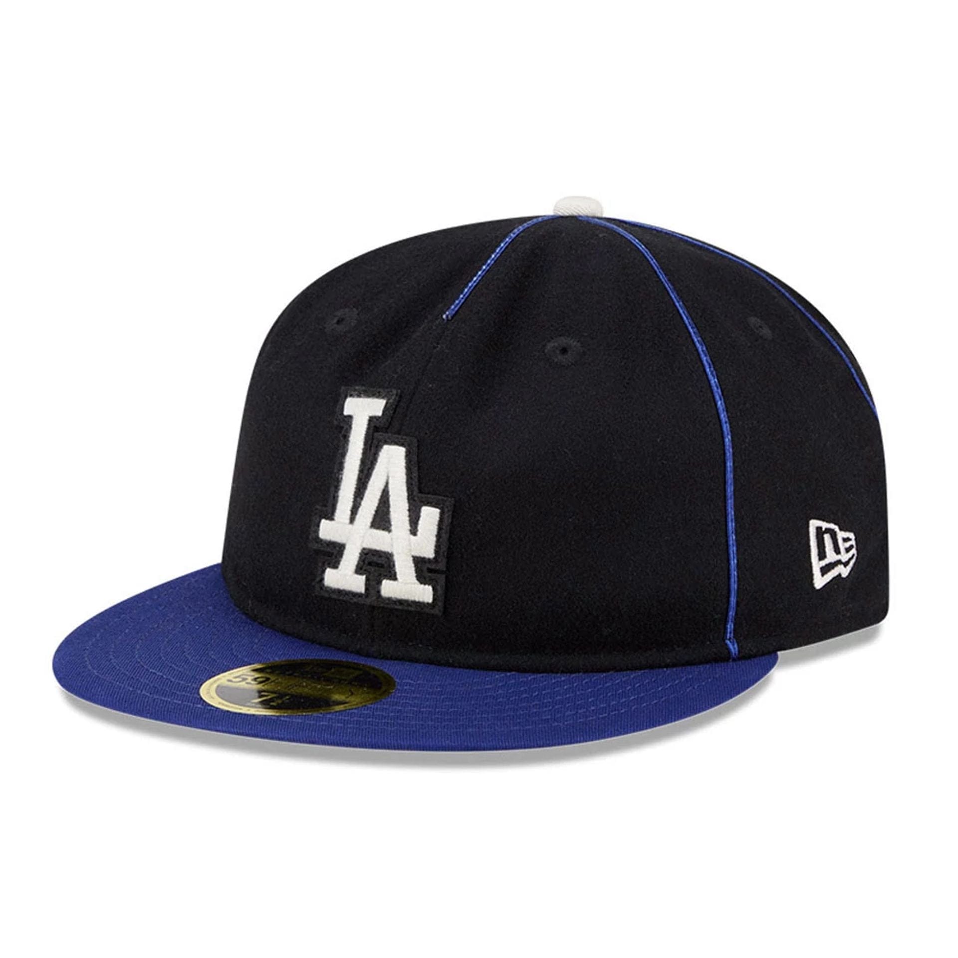 Pictured is this MLB Felt Logo LA Dodgers Retro Crown 59FIFTY Fitted cap in dark blue. 1