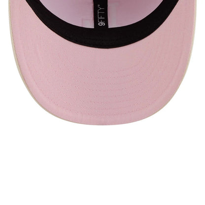 Pictured is this MLB Washed Tie Dye LA Dodgers 9FIFTY Snapback cap in pastel pink. 7
