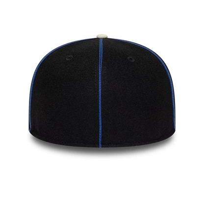 Pictured is this NBA Felt Logo New York Knicks Retro Crown 59FIFTY Fitted cap in dark blue. 7