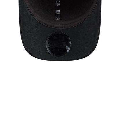 New Era Brushed Fleece Black 9FORTY M-Crown Adjustable Cap, inside view showing the black taping along the interior crown panels with 9FORTY printed in white, featuring a black 9FORTY size sticker on the underside of the black visor.