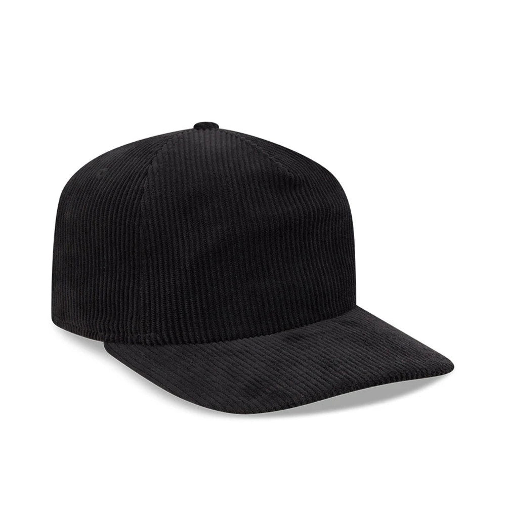New Era Wide Cord Black 19TWENTY Adjustable Cap, three-quarter view showing the textured black wide corduroy fabric covering the full crown and curved visor, with a centred top button and unstructured relaxed fit for comfort.