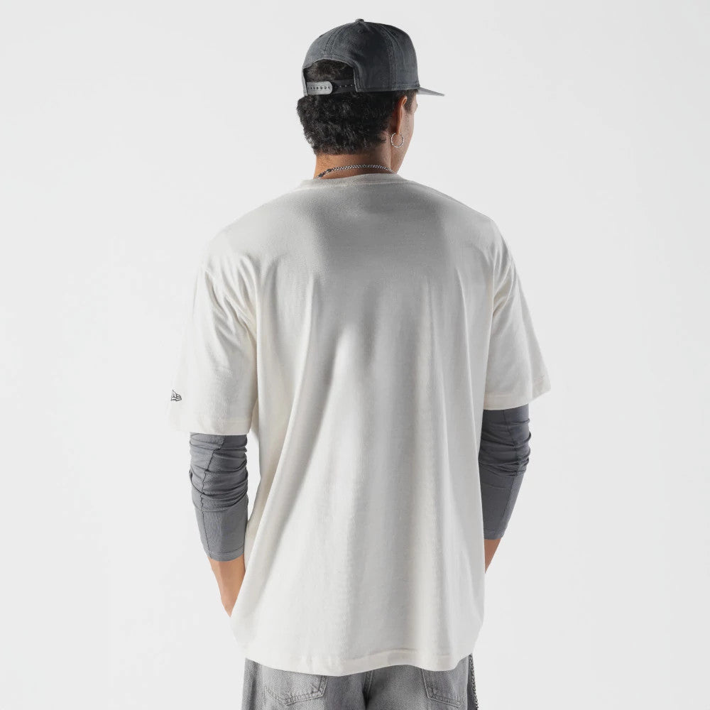 The model is wearing this Rick And Morty Spaceship T-Shirt in cream. 2