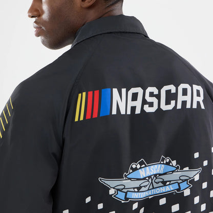 The model is wearing this Nascar Logo Jacket in black. 4