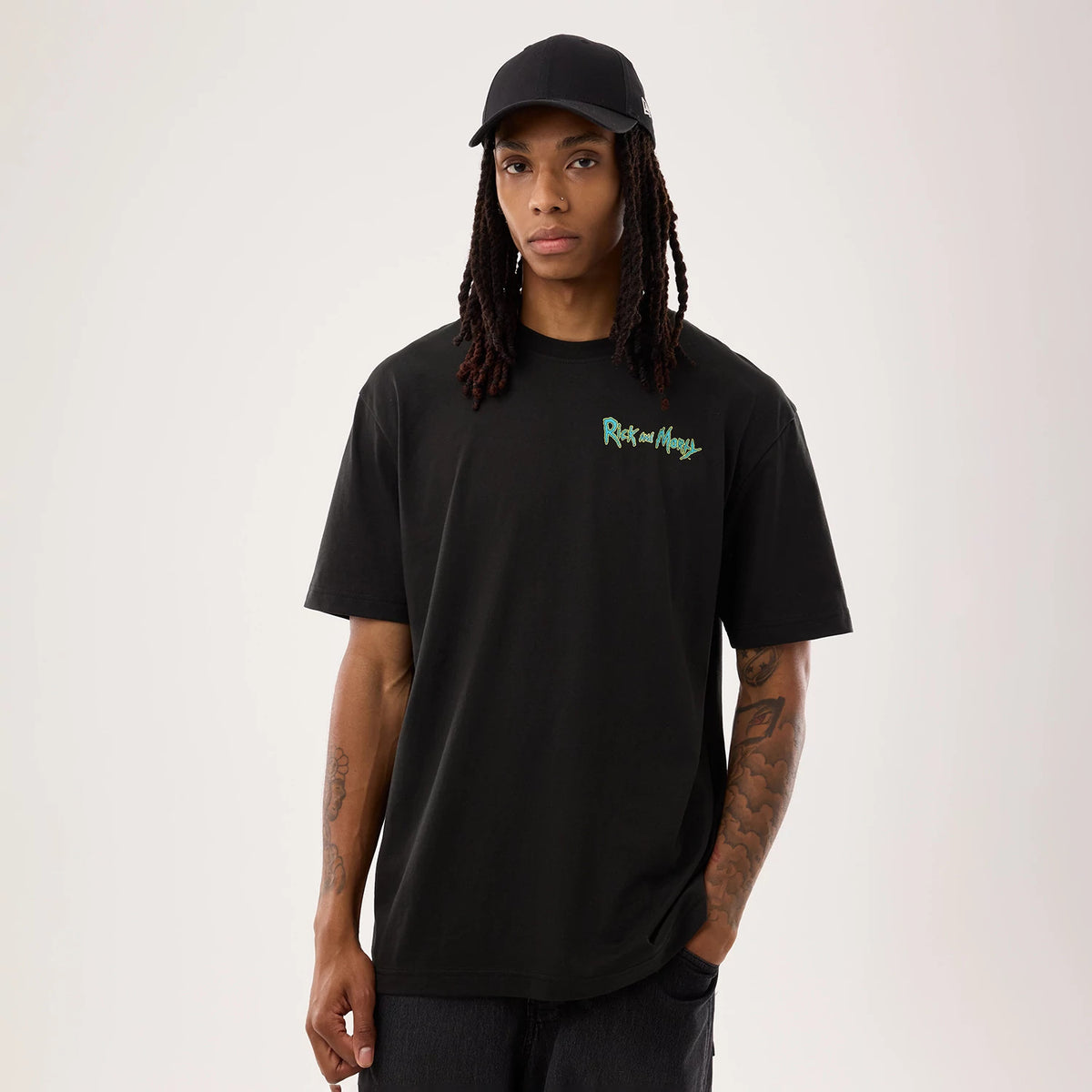 The model is wearing this Rick And Morty Portal Gun T-Shirt in black. 1