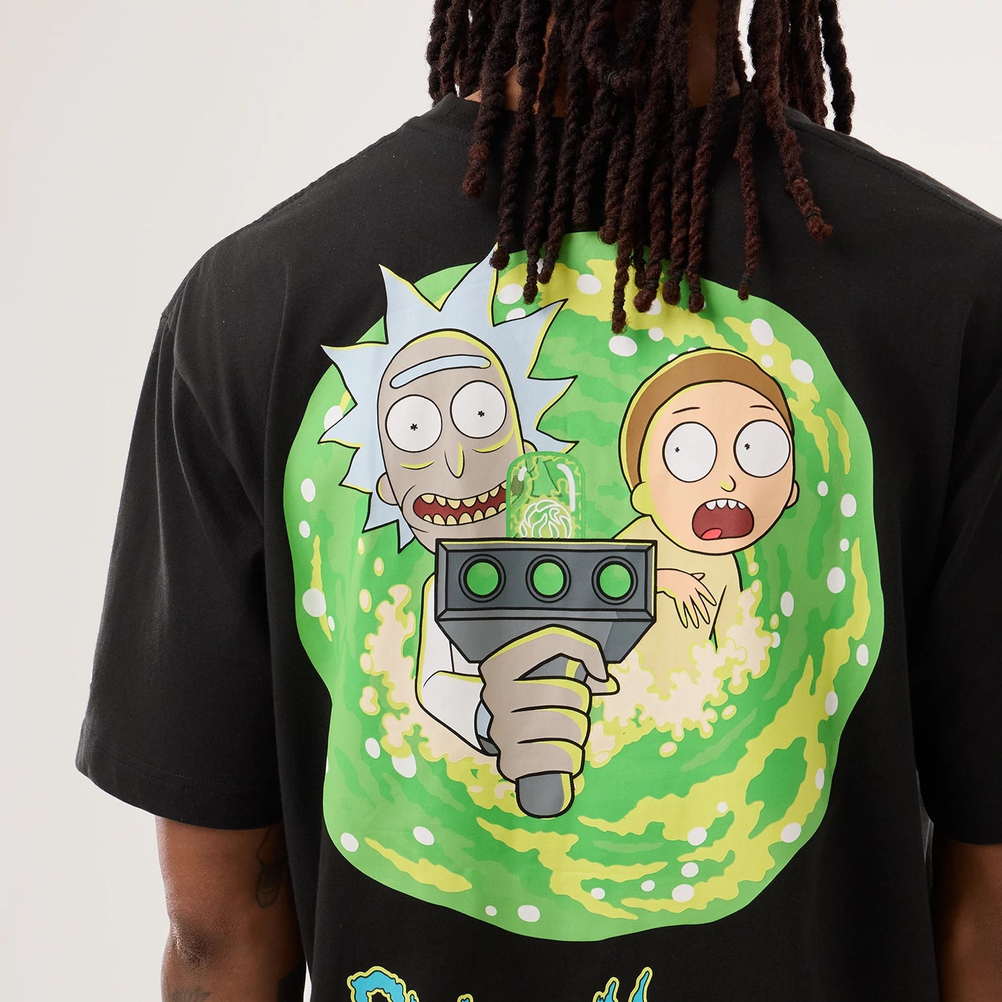 The model is wearing this Rick And Morty Portal Gun T-Shirt in black. 4