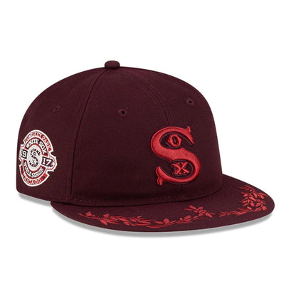 Pictured is this MLB Flourishes Chicago White Sox Retro Crown 9FIFTY cap in dark purple. 1