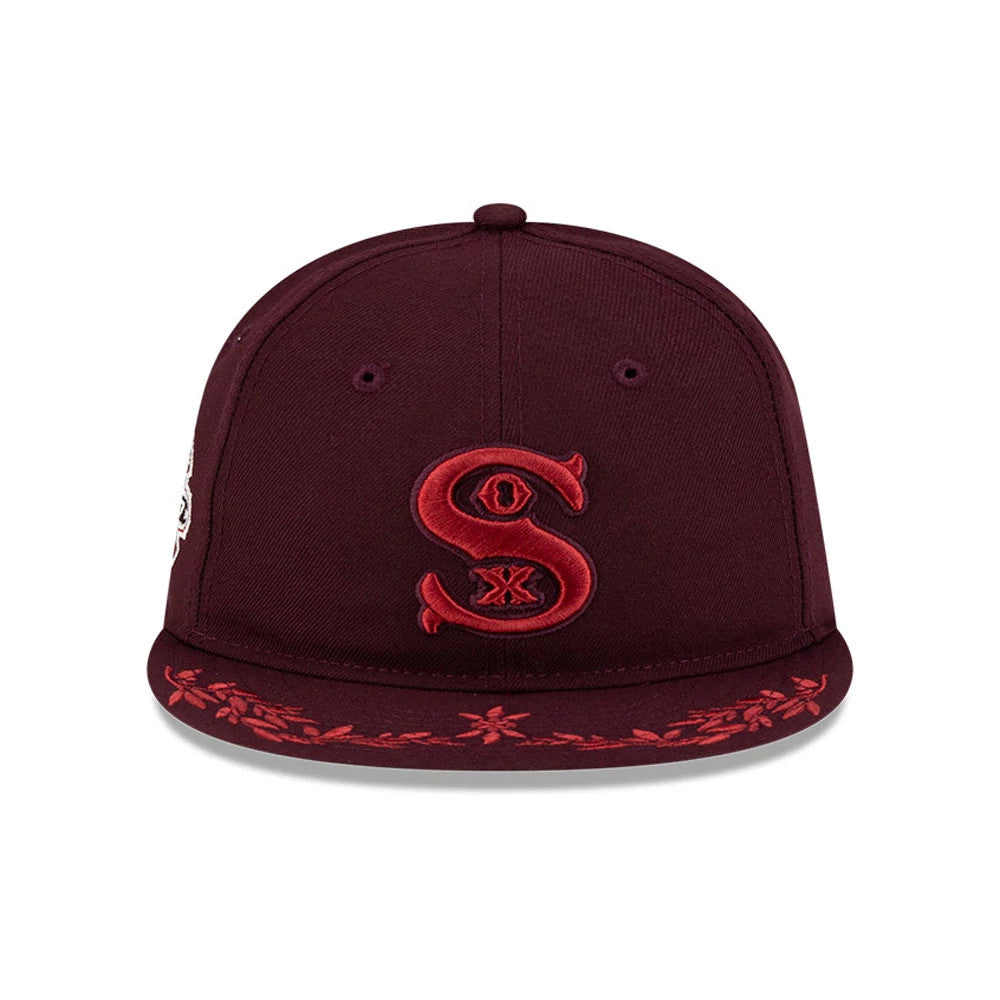 Chicago White Sox MLB Flourishes Purple Retro Crown New Era 9FIFTY Cap, front view showing a red embroidered 'Sox' logo on the centre of the purple crown, with red floral embroidery along the edge of the matching purple flat visor.