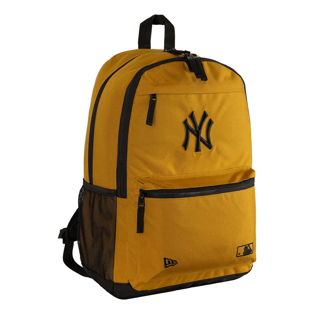 New Era New York Yankees MLB Yellow Delaware Backpack, three-quarter view showing the large black embroidered Yankees logo on the top front pocket, a zip closure, side mesh pocket, and small embroidered New Era and MLB Batterman logos near the base.