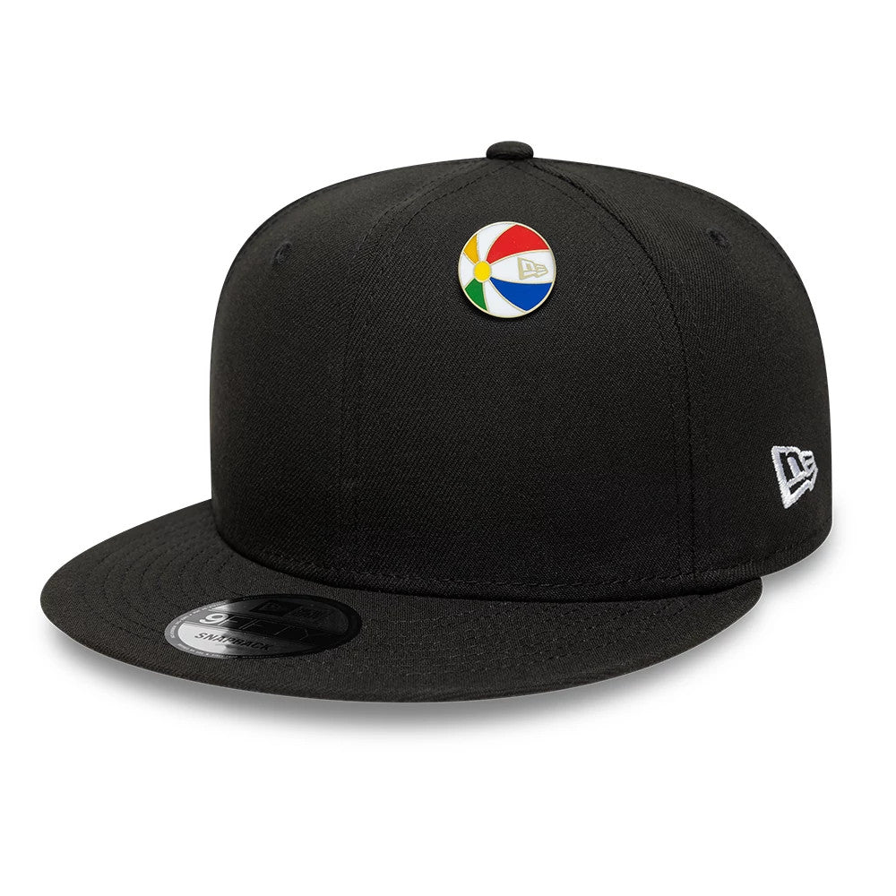 Pictured is this New Era Beachball Pin Badge in gold. 2