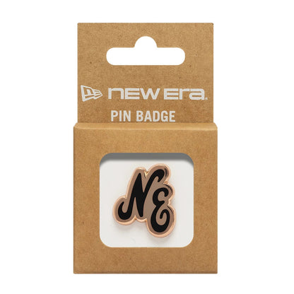 New Era Script Herritage Connect Rose Gold Pin Badge, front view featuring the elegant NE script design in black with a rose gold outline, showcased in a cardboard display backing with branded New Era lettering and an open window.