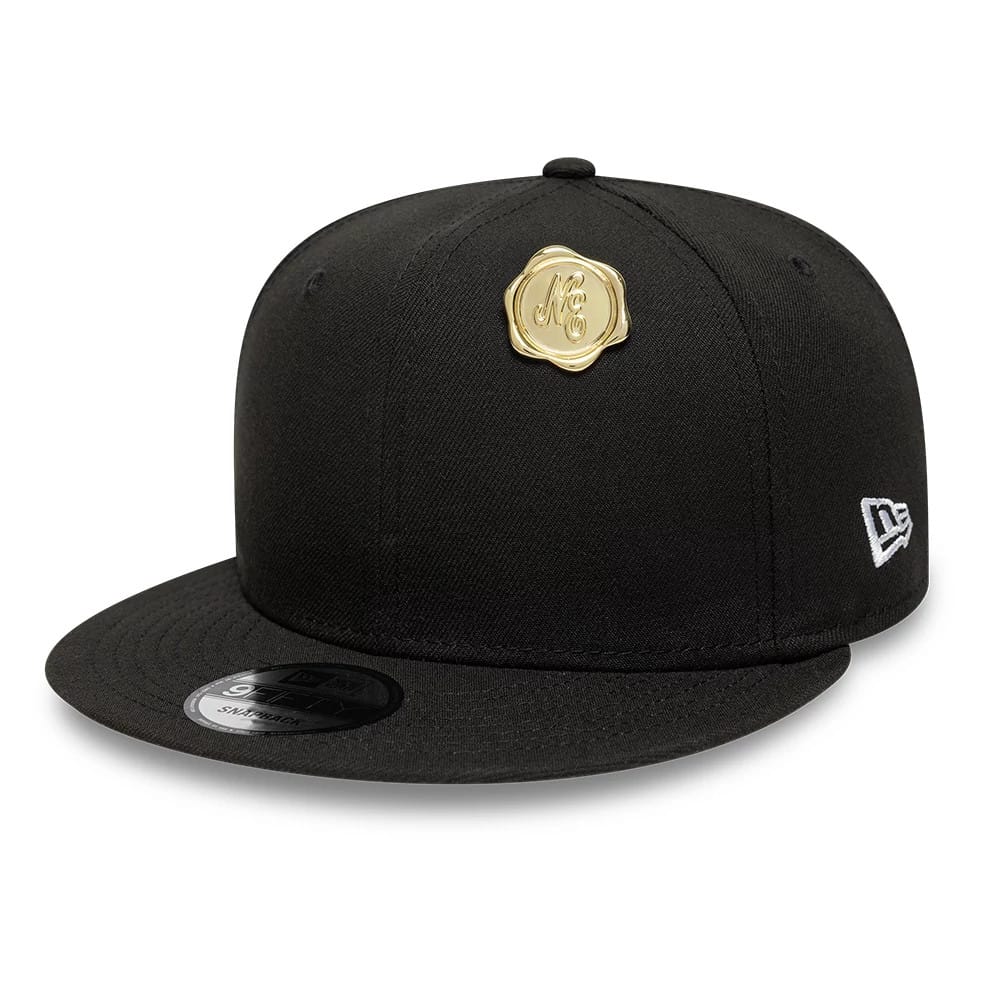 Pictured is this New Era Stamp Pin Badge in gold. 2