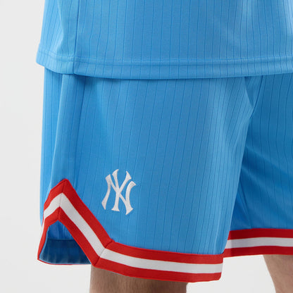 The model is wearing this MLB Arch New York Yankees Oversized Shorts in pastel blue. 4