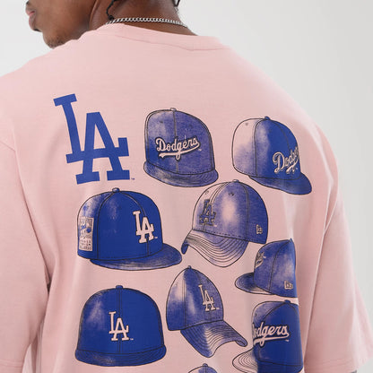 The model is wearing this MLB Cap Graphic LA Dodgers Oversized T-Shirt in pastel pink. 8