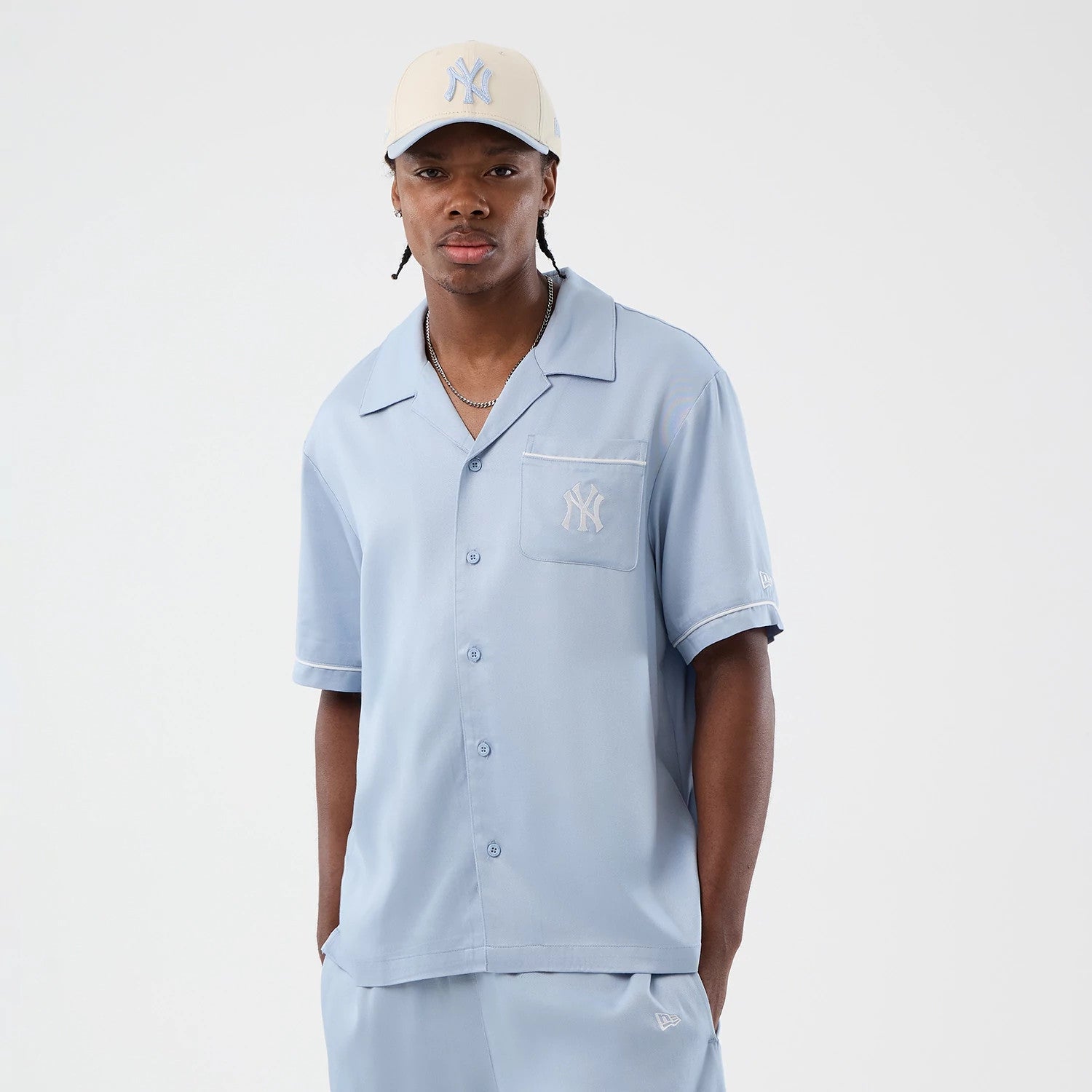 The model is wearing this MLB Graphic Revere New York Yankees Short Sleeve Shirt in pastel blue. 3