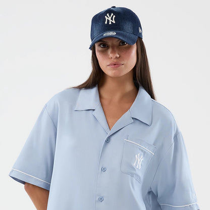 The model is wearing this MLB Graphic Revere New York Yankees Short Sleeve Shirt in pastel blue. 6