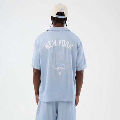 The model is wearing this MLB Graphic Revere New York Yankees Short Sleeve Shirt in pastel blue. 2