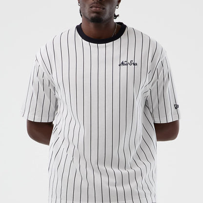 The model is wearing this New Era Pinstripe Oversized T-Shirt in Open White. 4