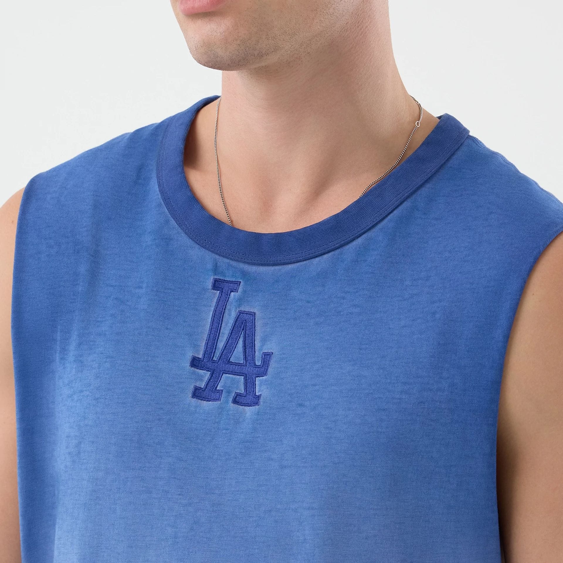The model is wearing this MLB Washed Logo LA Dodgers Vest in pastel blue. 4