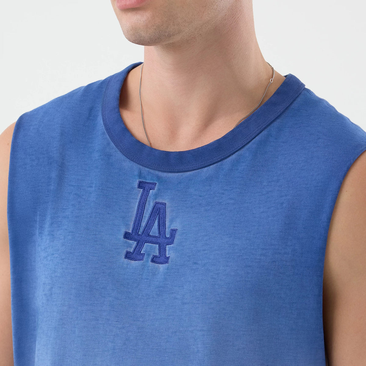 The model is wearing this MLB Washed Logo LA Dodgers Vest in pastel blue. 4