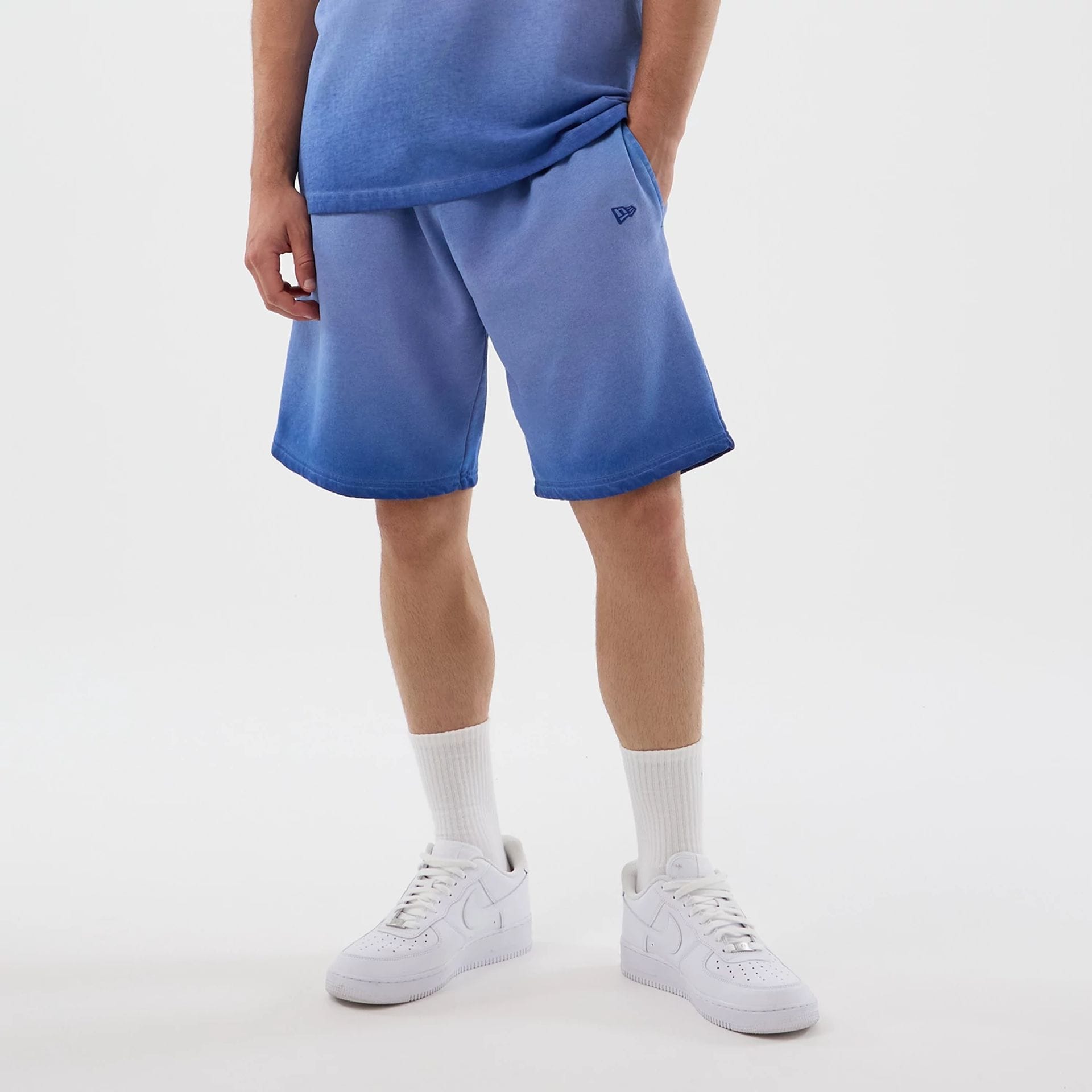 The model is wearing this MLB Washed Logo LA Dodgers Shorts in pastel blue. 1