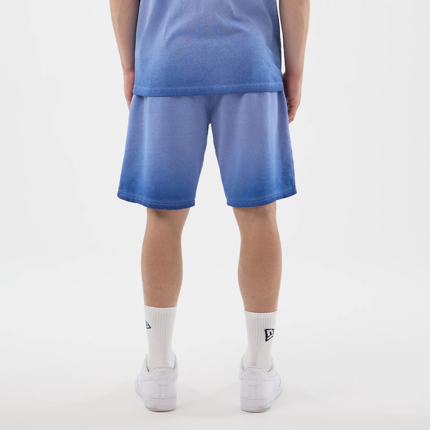 The model is wearing this MLB Washed Logo LA Dodgers Shorts in pastel blue. 3