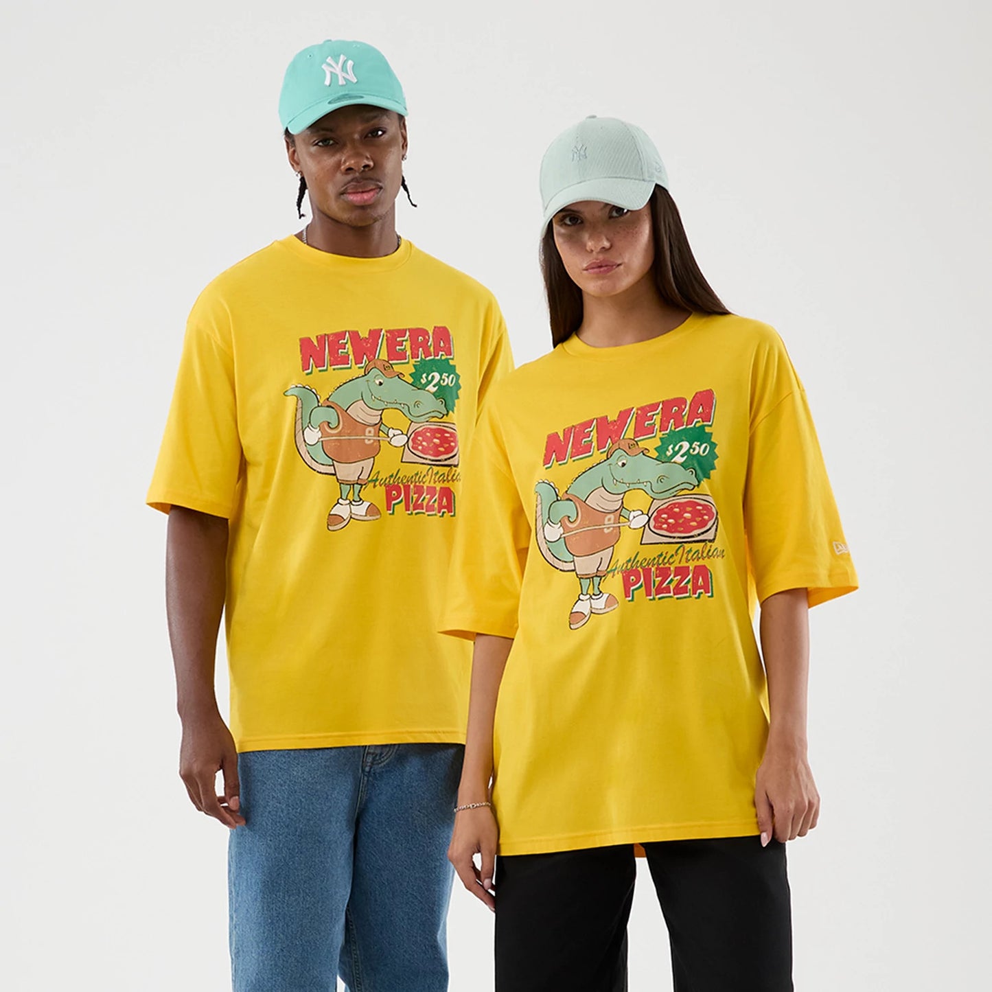 The model is wearing this New Era Alligator Character Graphic T-Shirt in yellow. 1