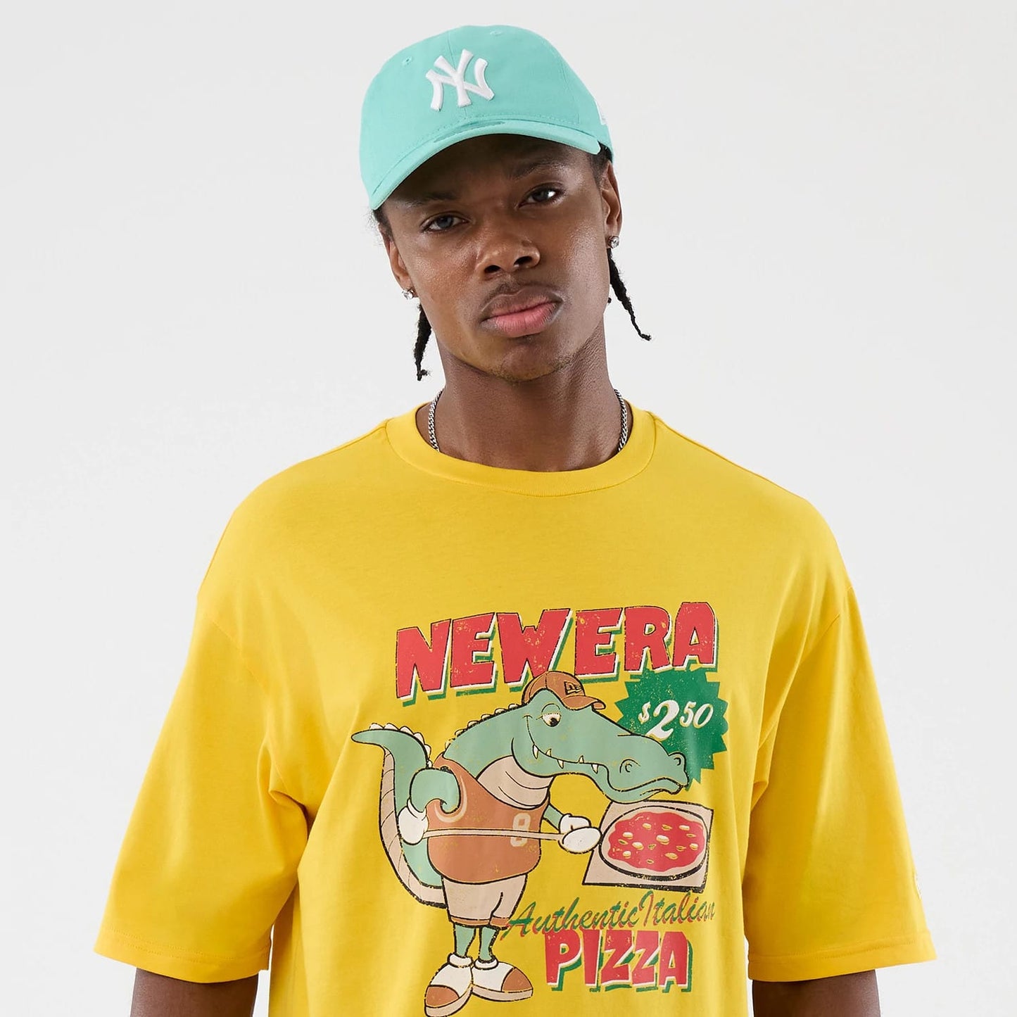 The model is wearing this New Era Alligator Character Graphic T-Shirt in yellow. 6