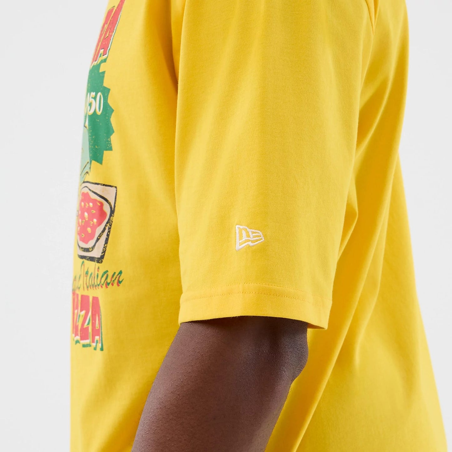 The model is wearing this New Era Alligator Character Graphic T-Shirt in yellow. 7