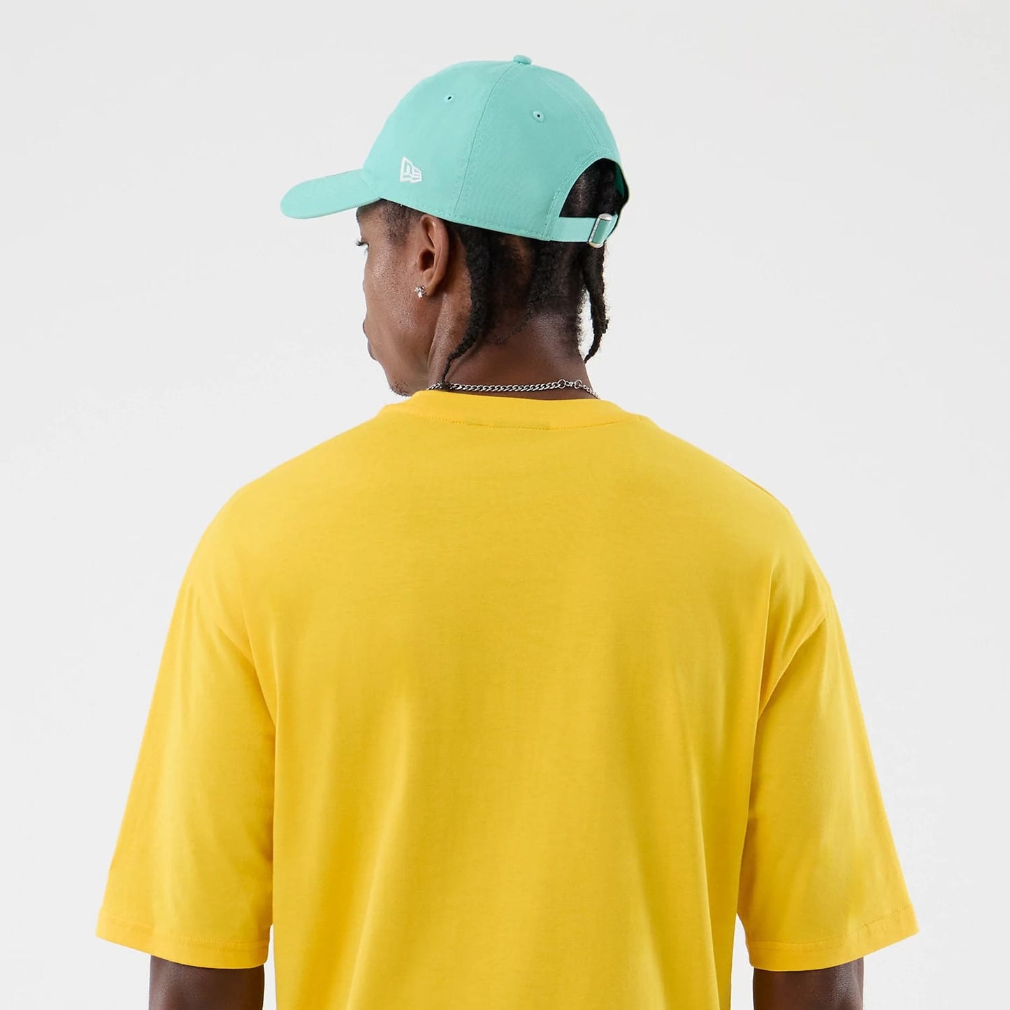 The model is wearing this New Era Alligator Character Graphic T-Shirt in yellow. 8