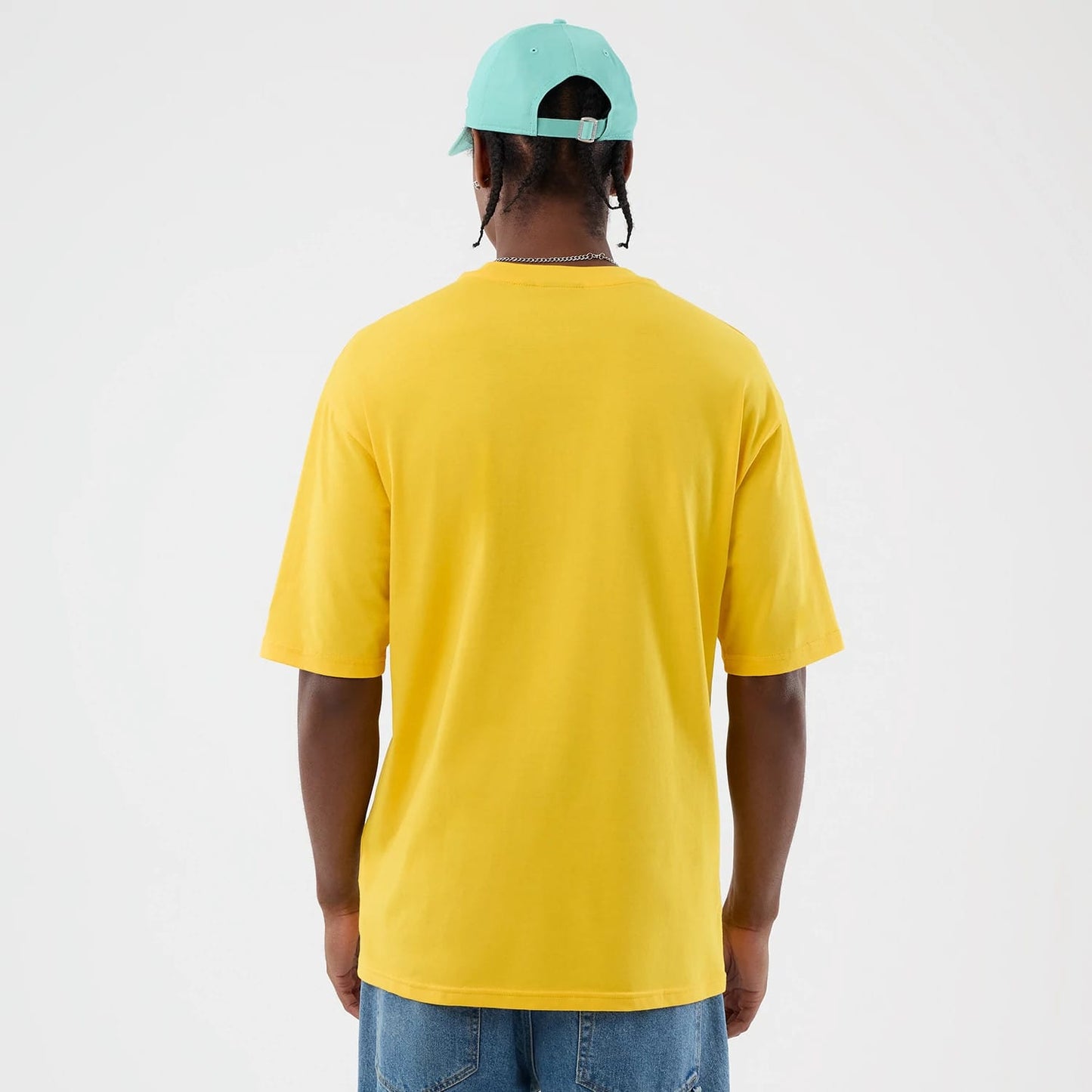 The model is wearing this New Era Alligator Character Graphic T-Shirt in yellow. 2