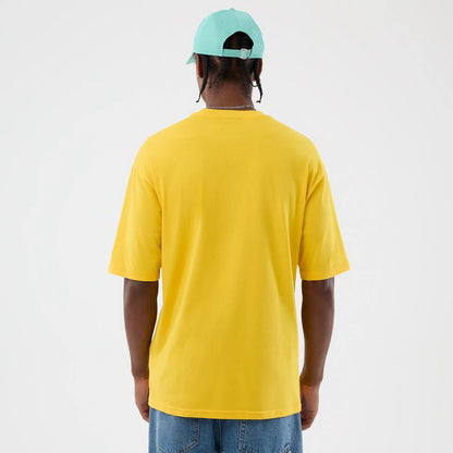 The model is wearing this New Era Alligator Character Graphic T-Shirt in yellow. 2
