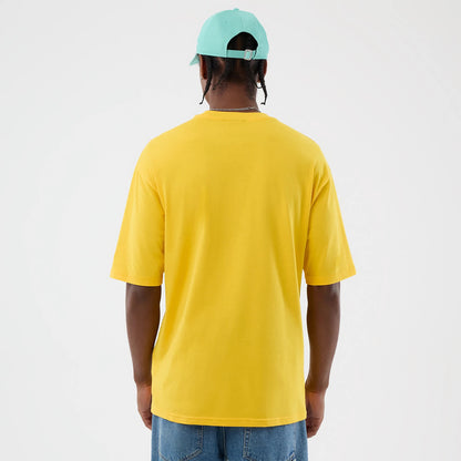 The model is wearing this New Era Alligator Character Graphic T-Shirt in yellow. 2