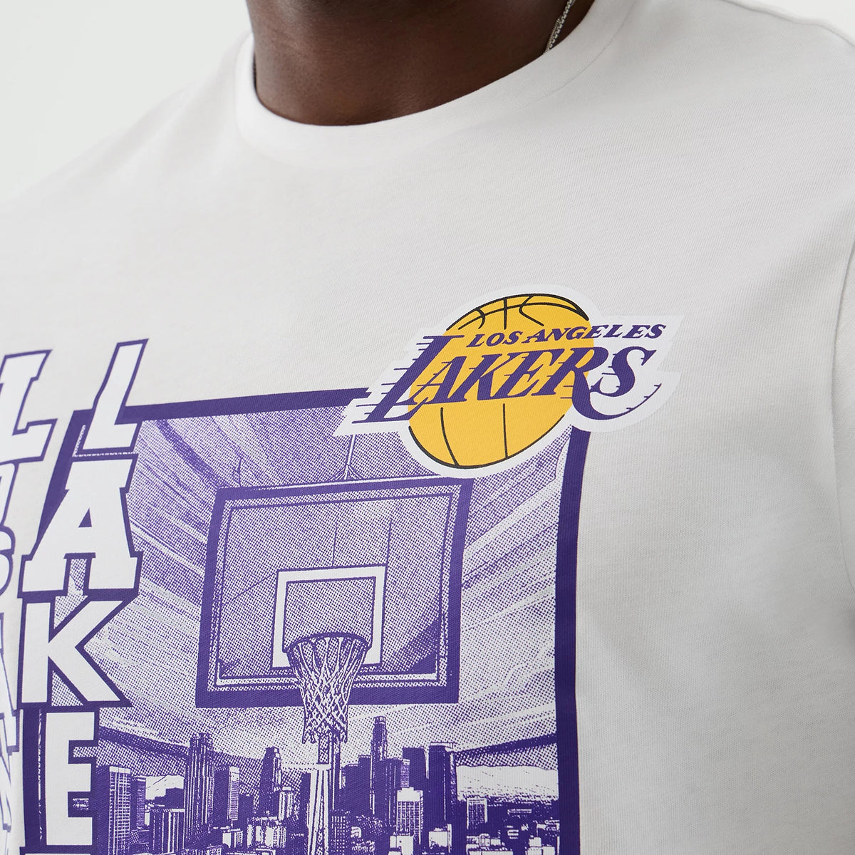 The model is wearing this NBA Graphic LA Lakers T-Shirt in white. 5
